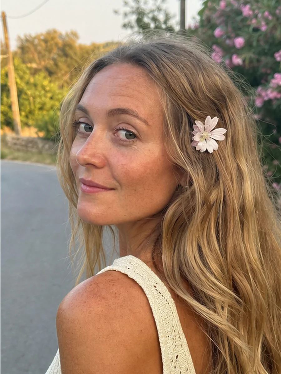 Flowers in hair pose 3 with a fictional adult model