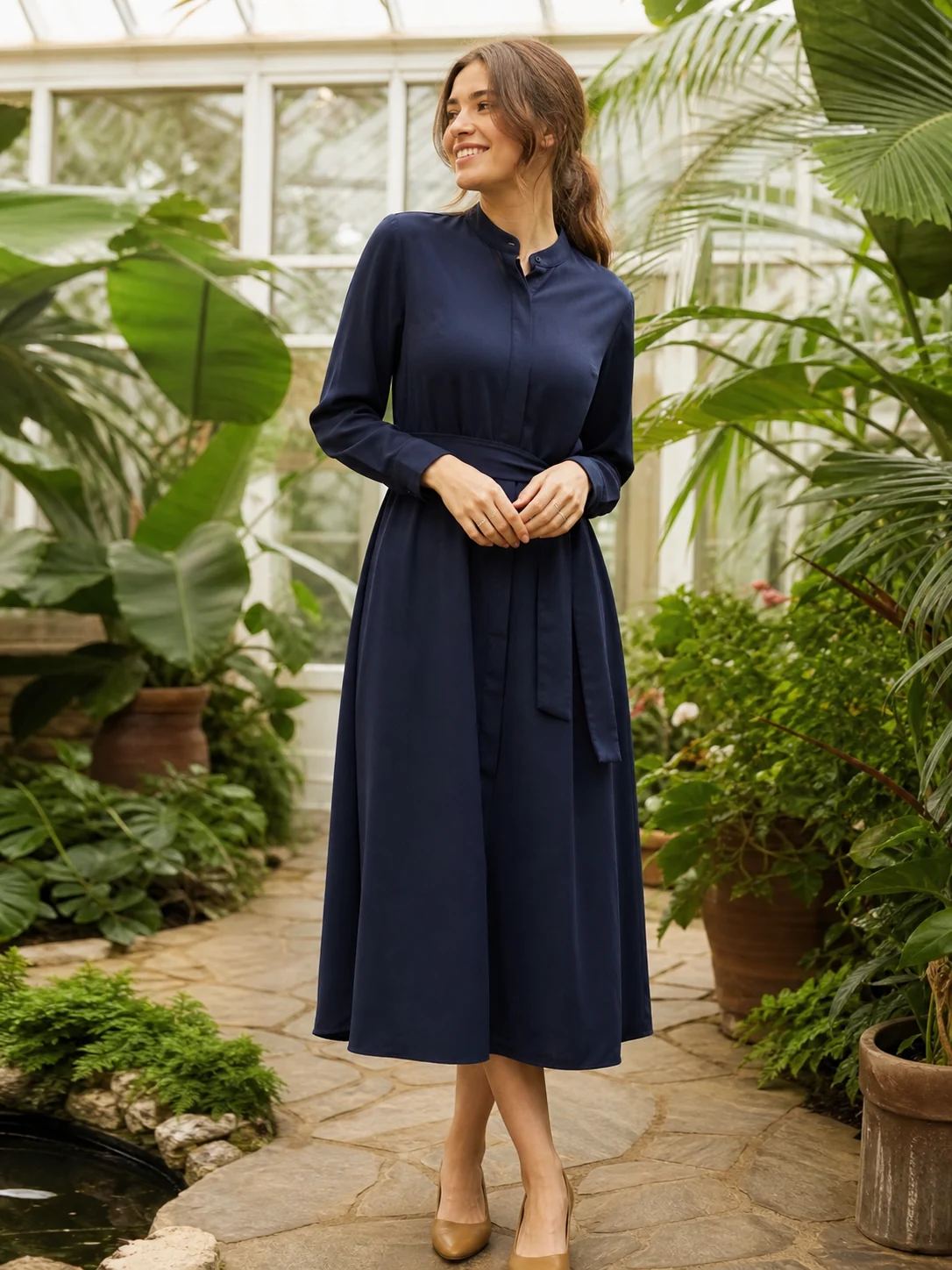 Navy high-collar midi dress worn by a fictional adult model